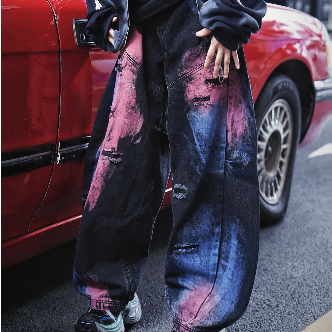 Blade-cut washed denim pants with a wide-leg fit for a relaxed streetwear silhouette. Stylish, comfortable, and perfect for daily outfits.