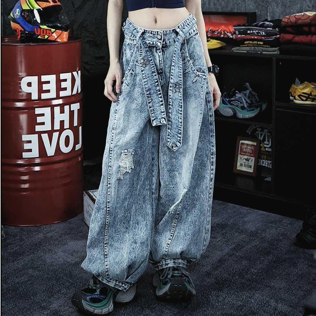 Retro-inspired wide-leg jeans featuring lantern-style drape and distressed cutouts. A unique American vintage streetwear statement.