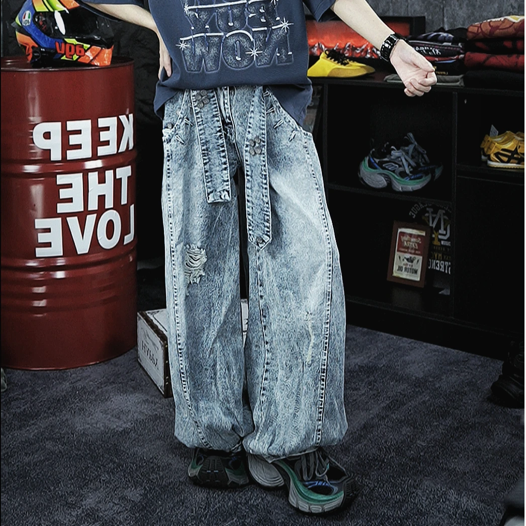 Retro-inspired wide-leg jeans featuring lantern-style drape and distressed cutouts. A unique American vintage streetwear statement.