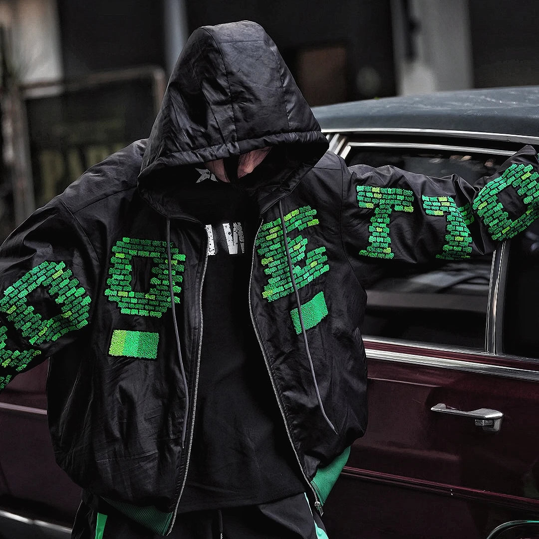 Sanhoostudio heavyweight hooded jacket features handcrafted patchwork details, a relaxed oversized fit, and a double-breasted front. Designed for winter warmth with bold street attitude.