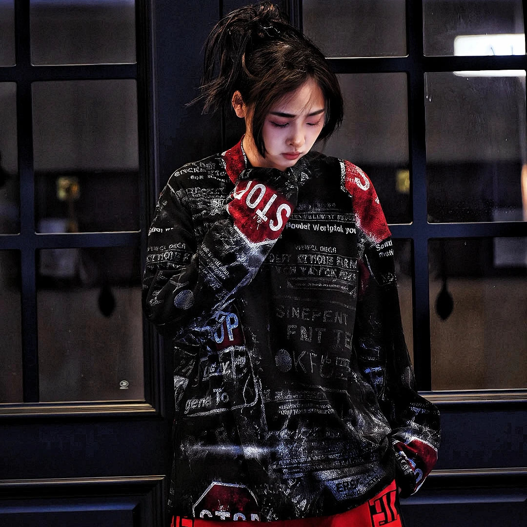 Sanhoostudio oversized graffiti shirt crafted from 100% nylon. Lightweight yet bold, featuring full graffiti print, sharp pointed collar, and relaxed hip-hop street silhouette for unisex styling.