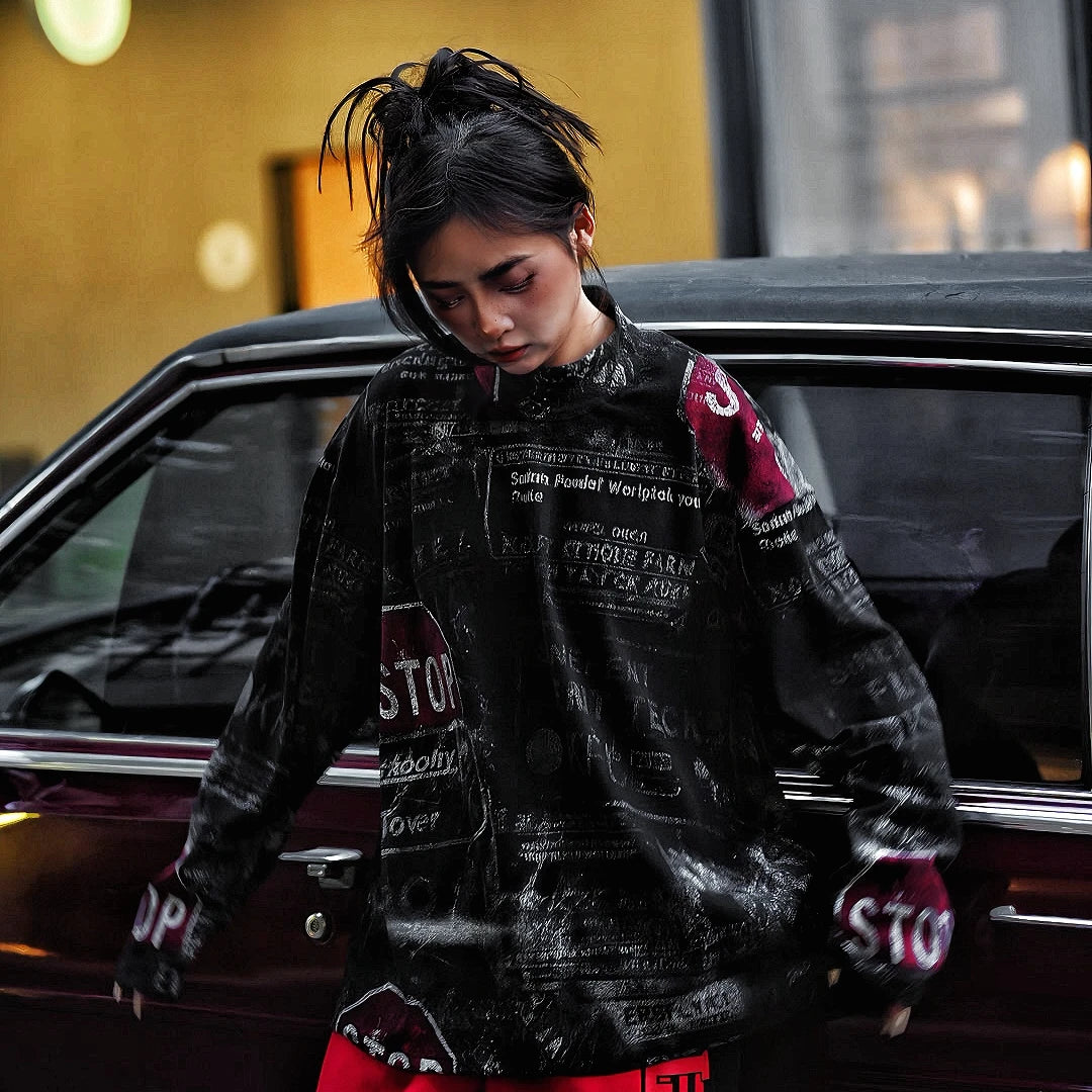 Sanhoostudio oversized graffiti shirt crafted from 100% nylon. Lightweight yet bold, featuring full graffiti print, sharp pointed collar, and relaxed hip-hop street silhouette for unisex styling.