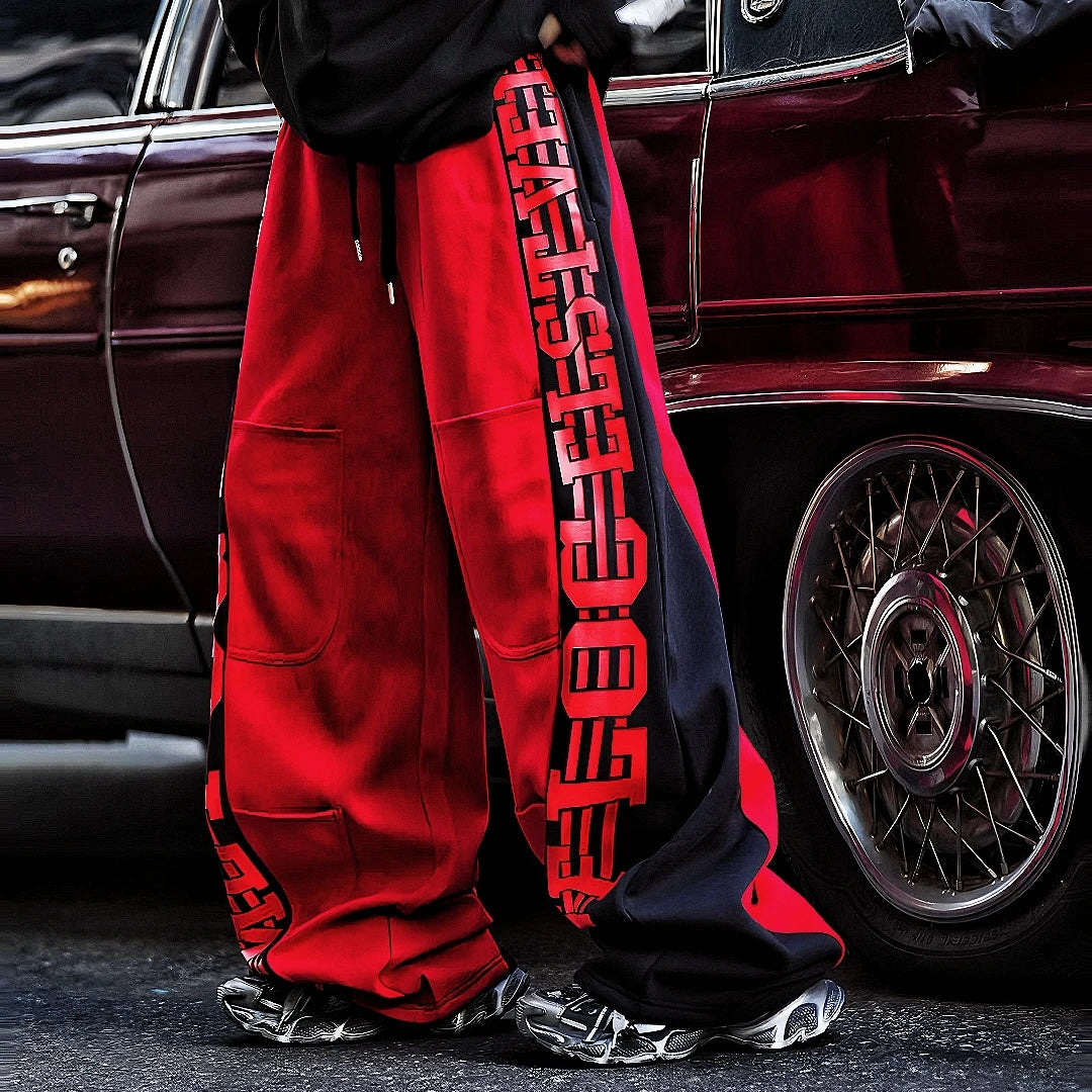 Sanhoostudio fleece-lined wide-leg pants made from cotton-poly blend. Designed with vintage stripe print, high-waist cut, and oversized silhouette for warmth and effortless street versatility.