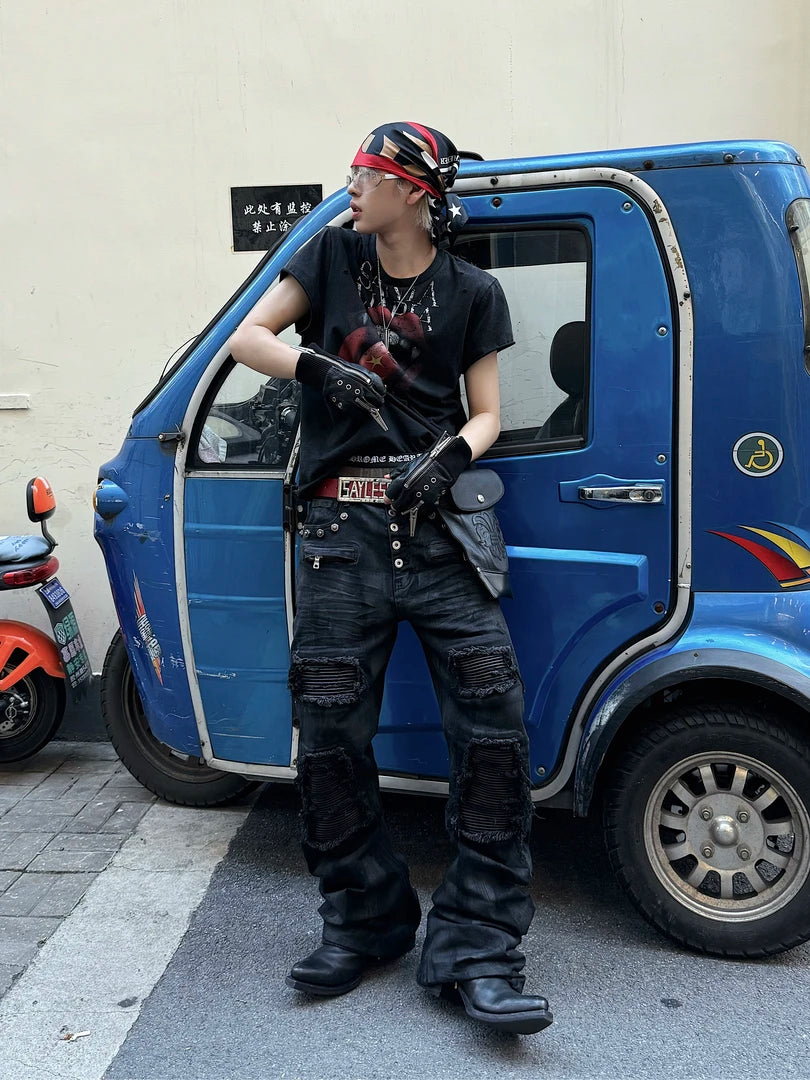 Sanhoostudio wax-finished denim pants made from breathable 100% cotton. Designed with curved cutting, distressed paneling, subtle stretch feel, and straight-leg silhouette for a bold dark street aesthetic.