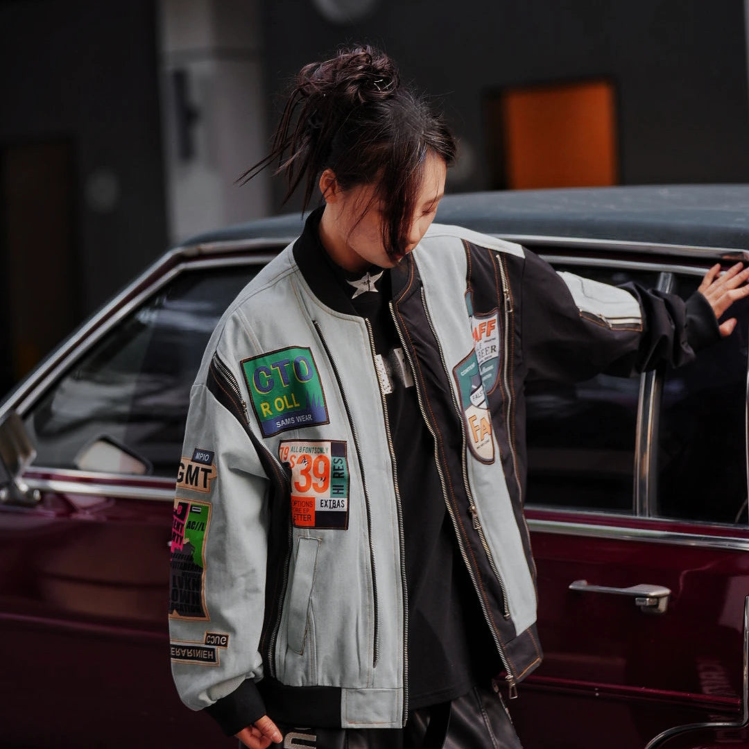 Sanhoostudio vintage colorblock denim varsity jacket with washed texture and relaxed hooded fit. A unisex streetwear outerwear piece for everyday layering.