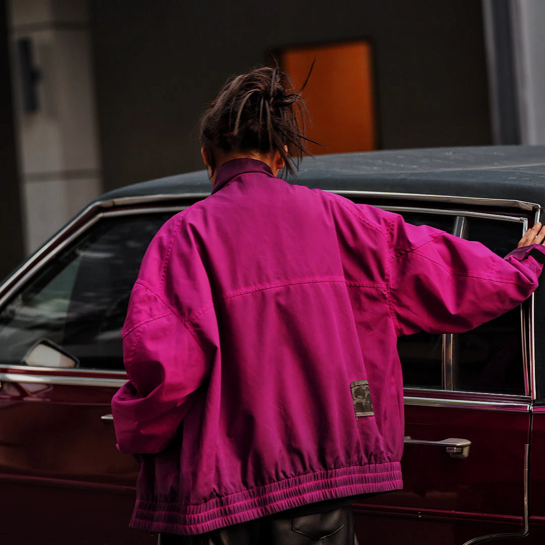 Sanhoostudio cropped bomber jacket with patch embroidery and wrinkle-resistant cotton fabric. Inspired by American varsity culture and streetwear aesthetics.