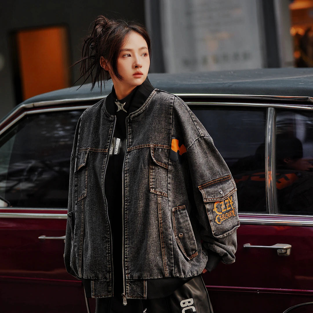 Sanhoostudio washed denim varsity jacket featuring contrast paneling and relaxed fit. A timeless unisex jacket for everyday streetwear layering.