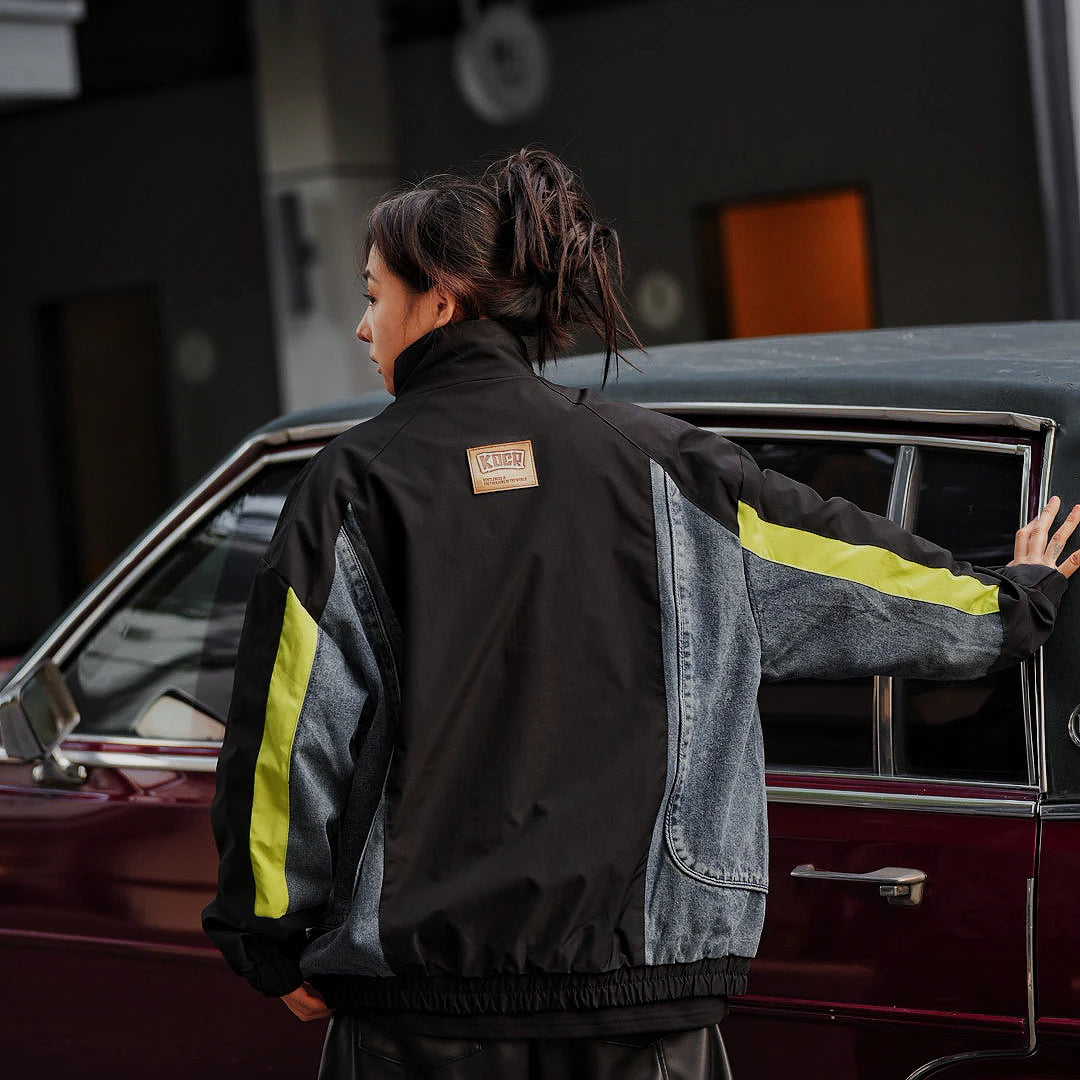 Sanhoostudio washed denim varsity jacket featuring contrast paneling and relaxed fit. A timeless unisex jacket for everyday streetwear layering.