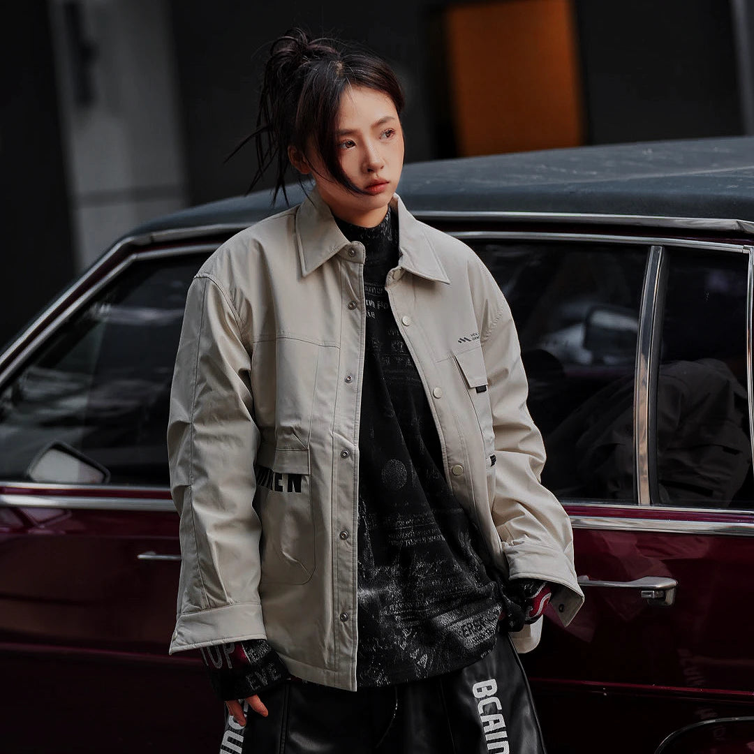 Sanhoostudio washed denim varsity jacket featuring contrast paneling and relaxed fit. A timeless unisex jacket for everyday streetwear layering.