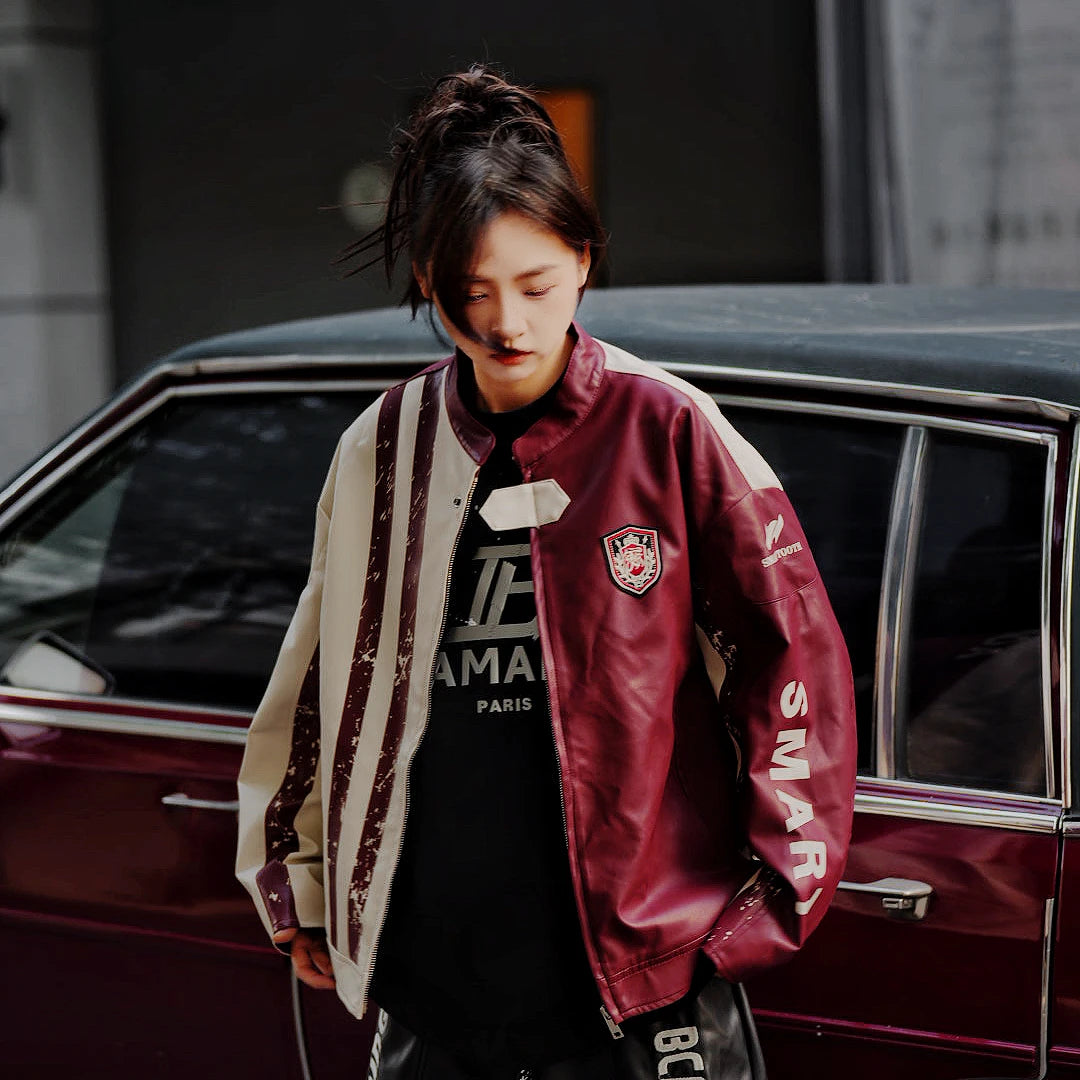 Sanhoostudio washed denim varsity jacket featuring contrast paneling and relaxed fit. A timeless unisex jacket for everyday streetwear layering.