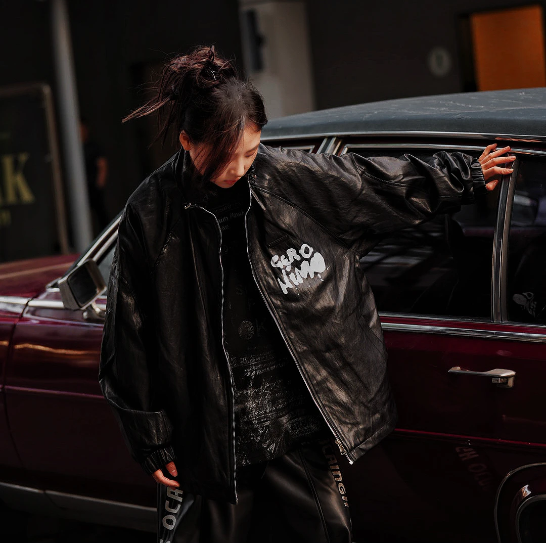 Sanhoostudio washed denim varsity jacket featuring contrast paneling and relaxed fit. A timeless unisex jacket for everyday streetwear layering.