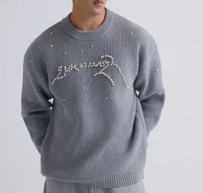 Sanhoostudio knit sweater featuring stud details and a relaxed fit. Designed for unisex autumn and winter streetwear layering.