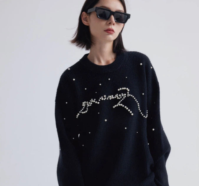Sanhoostudio knit sweater featuring stud details and a relaxed fit. Designed for unisex autumn and winter streetwear layering.