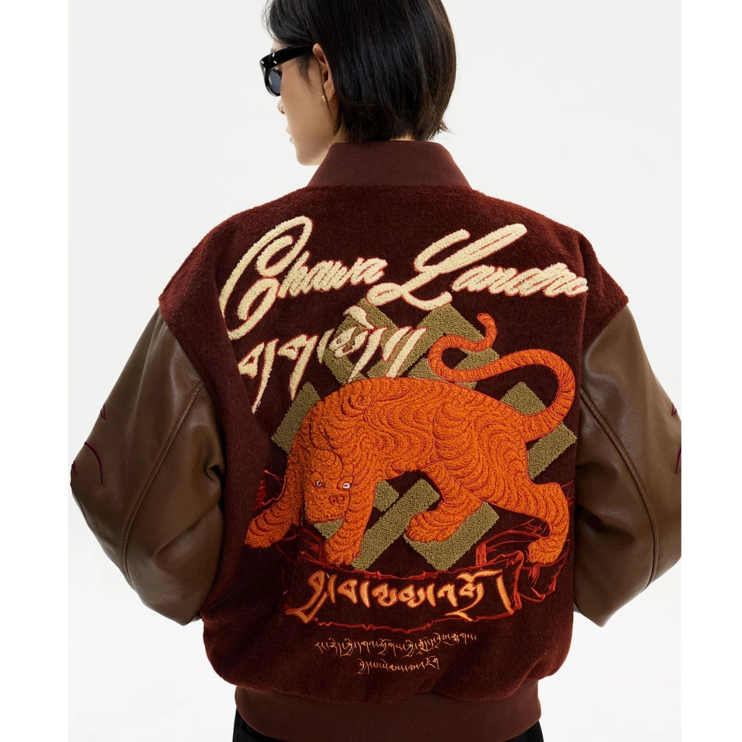 Sanhoostudio heavyweight varsity jacket featuring embroidered details and high street design. A bold unisex streetwear outerwear piece built for modern urban styling.