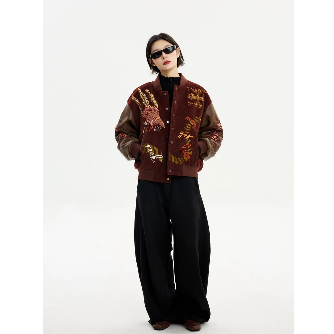 Sanhoostudio heavyweight varsity jacket featuring embroidered details and high street design. A bold unisex streetwear outerwear piece built for modern urban styling.