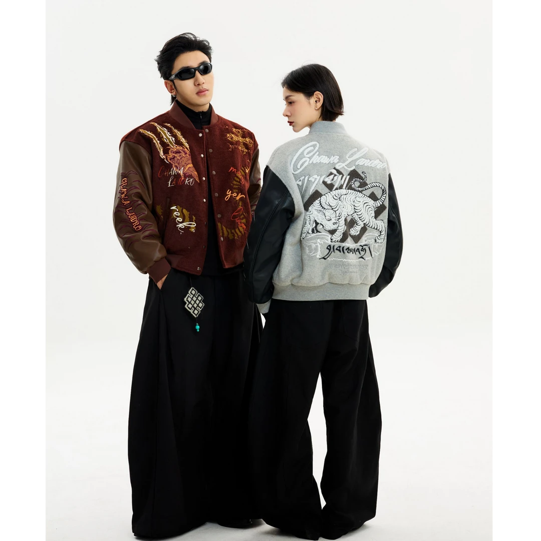 Sanhoostudio heavyweight varsity jacket featuring embroidered details and high street design. A bold unisex streetwear outerwear piece built for modern urban styling.