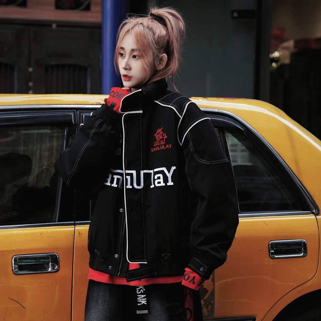 Sanhoostudio down jacket featuring letter embroidery, colorblock design, and white duck down filling. A loose-fit streetwear jacket inspired by biker style for winter wear.