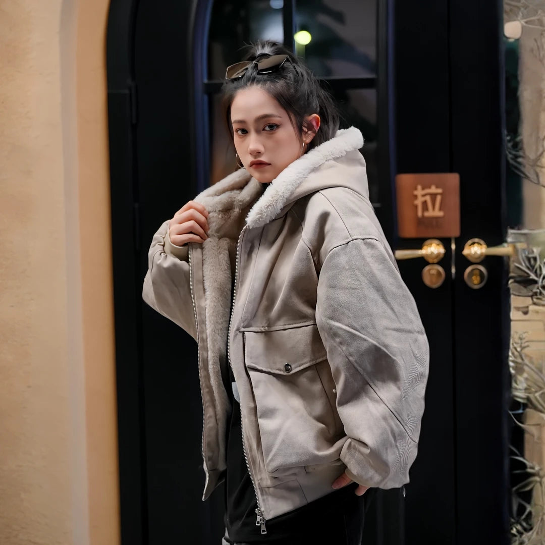 Sanhoostudio hooded puffer jacket in warm gray tone with a loose workwear fit. Designed for winter comfort and everyday streetwear looks.