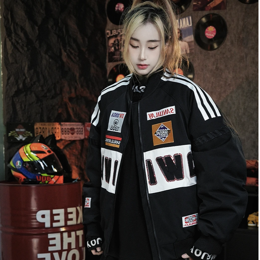 Sanhoostudio down puffer jacket featuring stand collar design, embroidered details, and biker-inspired styling. Designed with a thickened structure for unisex winter streetwear.