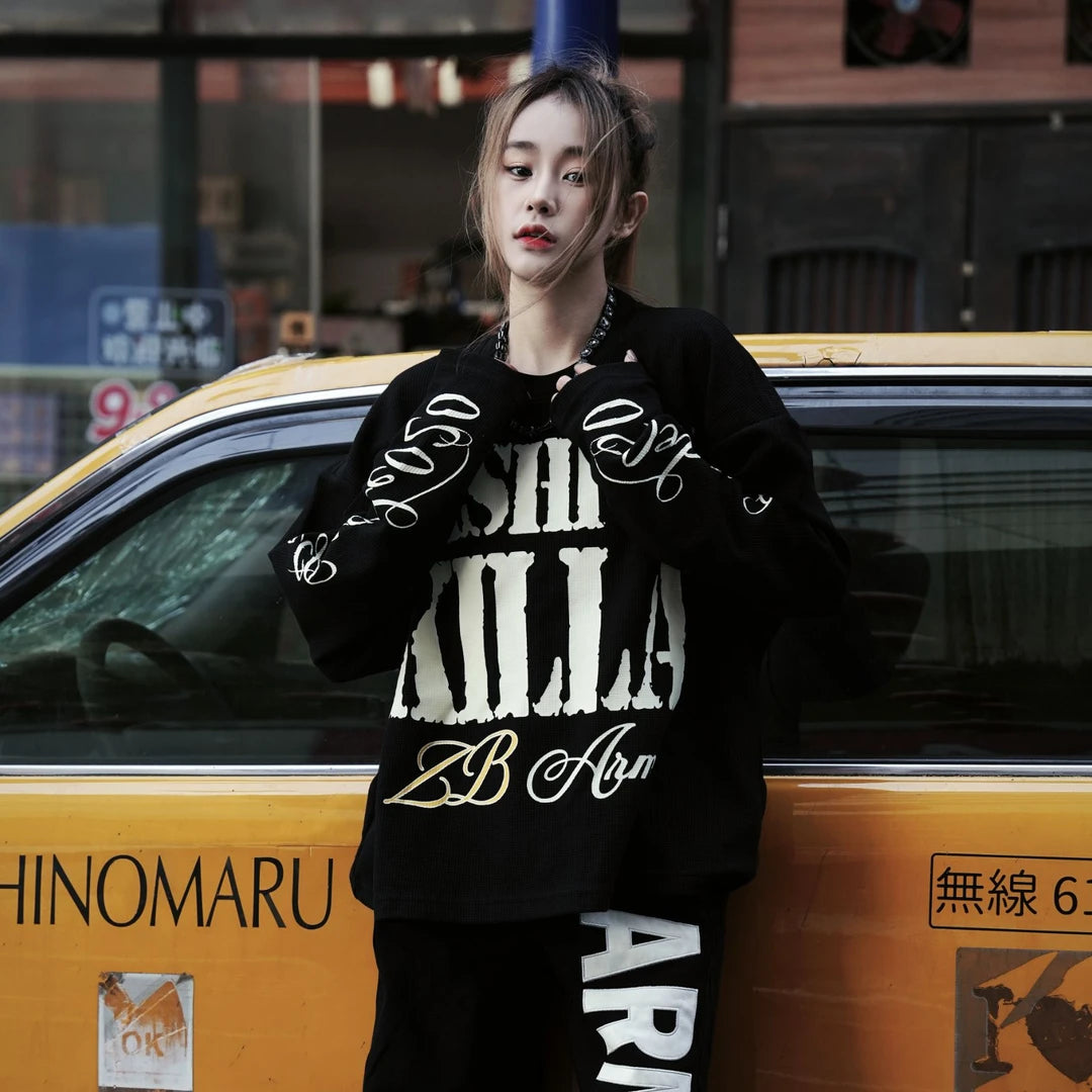 Sanhoostudio long sleeve T-shirt featuring graffiti letter print and vintage streetwear design for everyday urban styling.