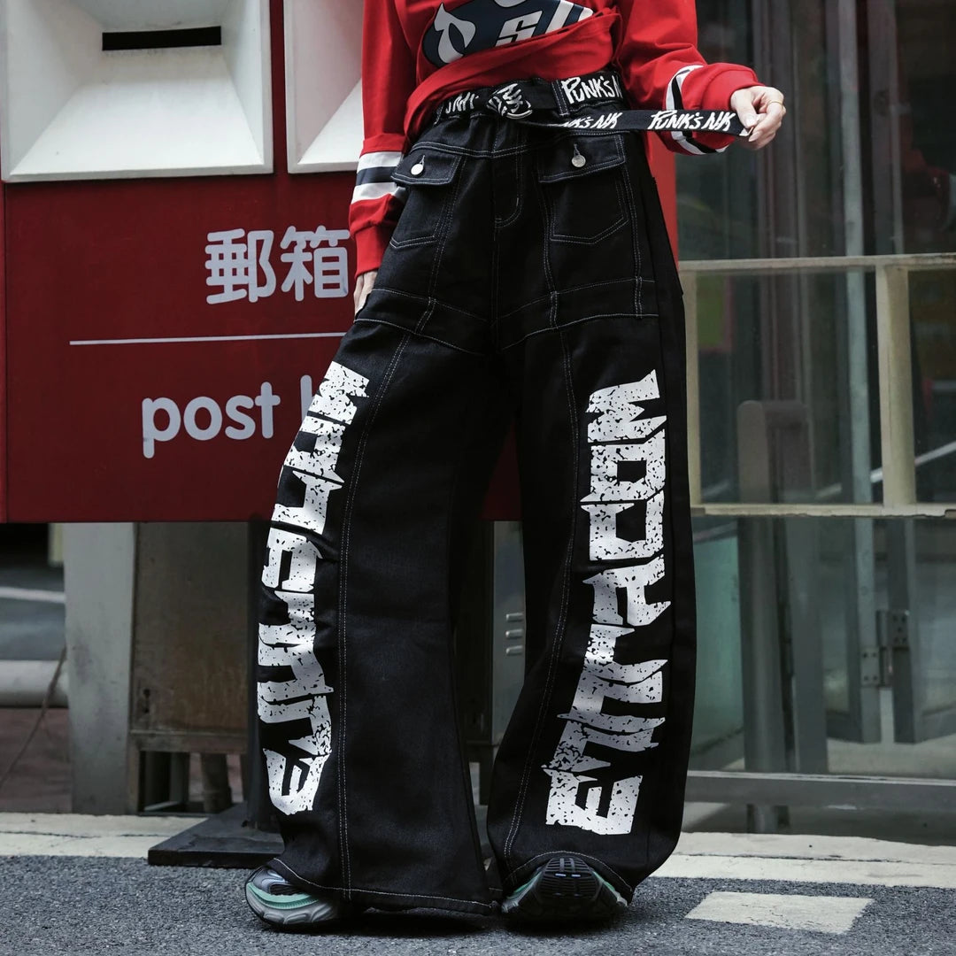 Sanhoostudio denim pants featuring scythe-cut silhouette and letter print design for modern streetwear styling.
