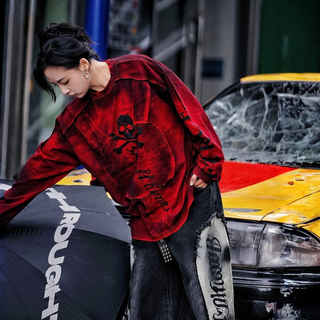 Sanhoostudio long sleeve T-shirt featuring graffiti print, patchwork construction, and relaxed fit. A versatile streetwear piece for layering and daily wear.