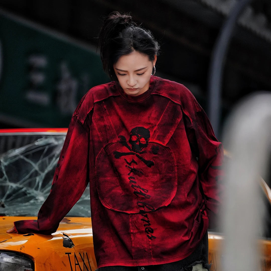 Sanhoostudio long sleeve T-shirt featuring graffiti print, patchwork construction, and relaxed fit. A versatile streetwear piece for layering and daily wear.