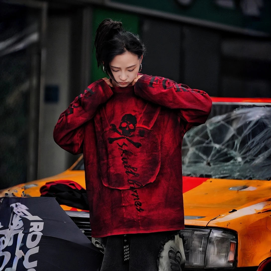 Sanhoostudio long sleeve T-shirt featuring graffiti print, patchwork construction, and relaxed fit. A versatile streetwear piece for layering and daily wear.
