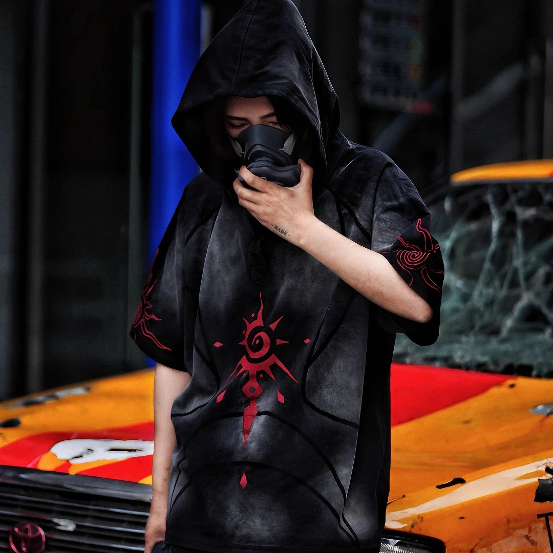 Sanhoostudio hooded T-shirt featuring graffiti print, patchwork construction, and relaxed fit for bold streetwear outfits.