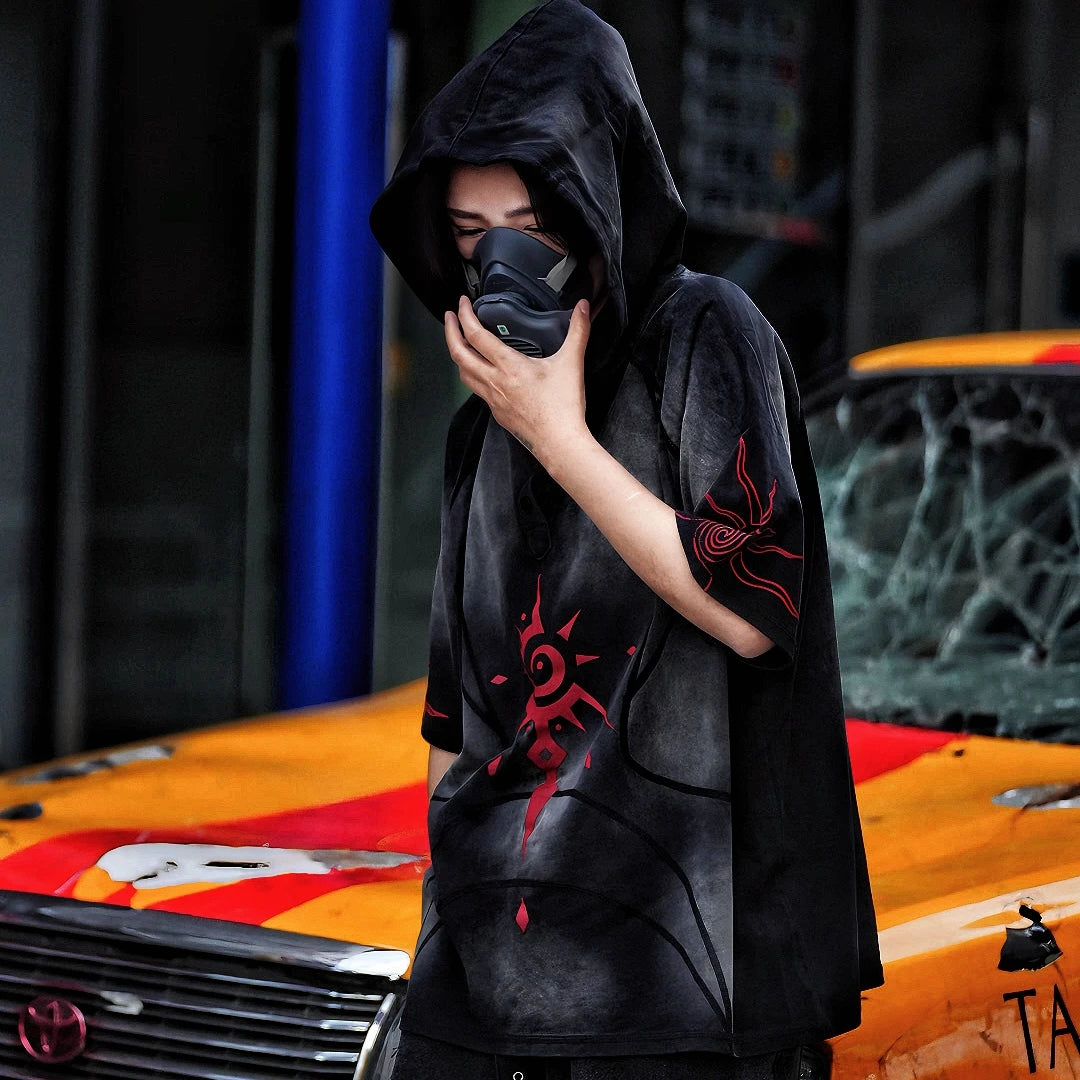 Sanhoostudio hooded T-shirt featuring graffiti print, patchwork construction, and relaxed fit for bold streetwear outfits.