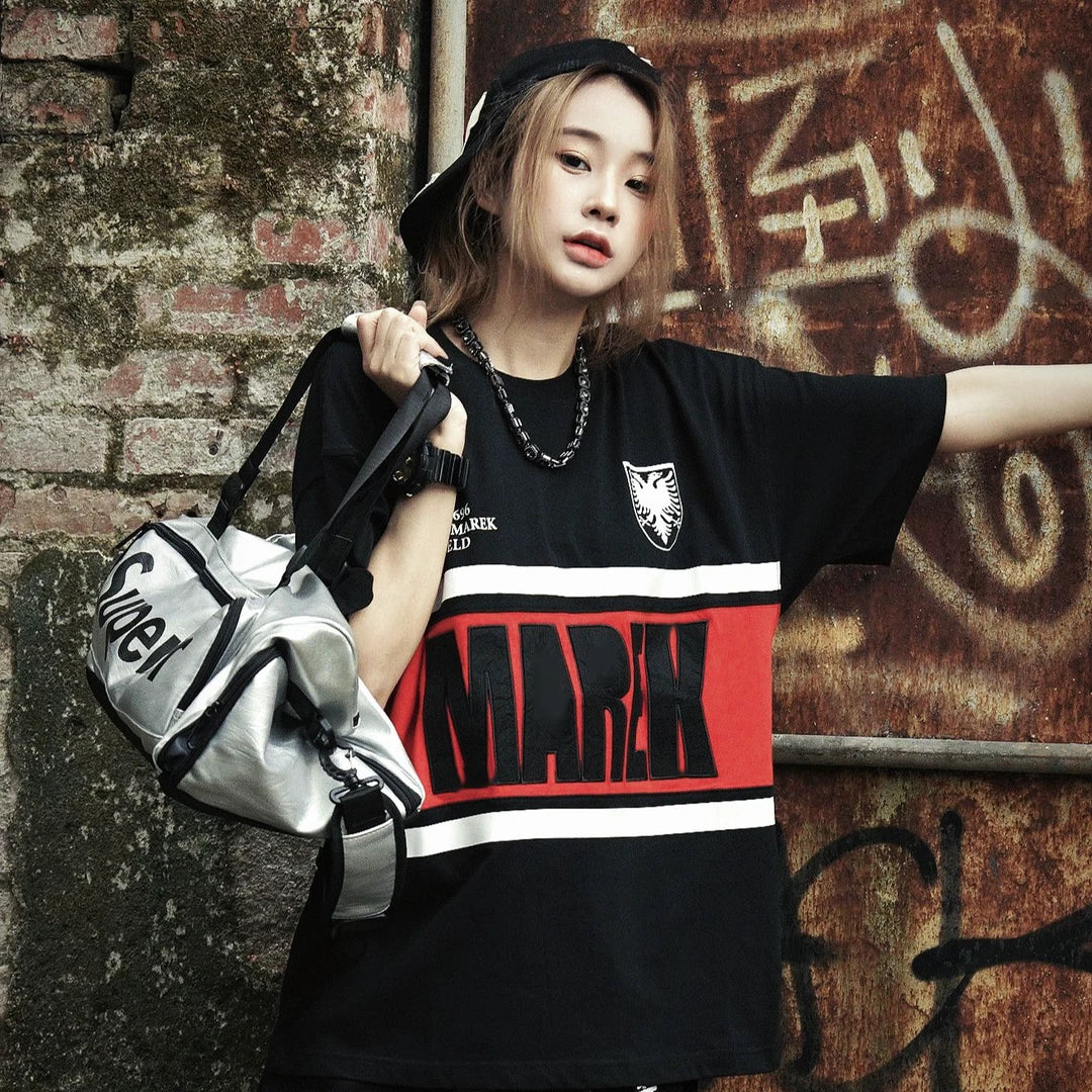 Sanhoostudio T-shirt featuring striped pattern and embroidered details with a relaxed fit for clean streetwear styling.
