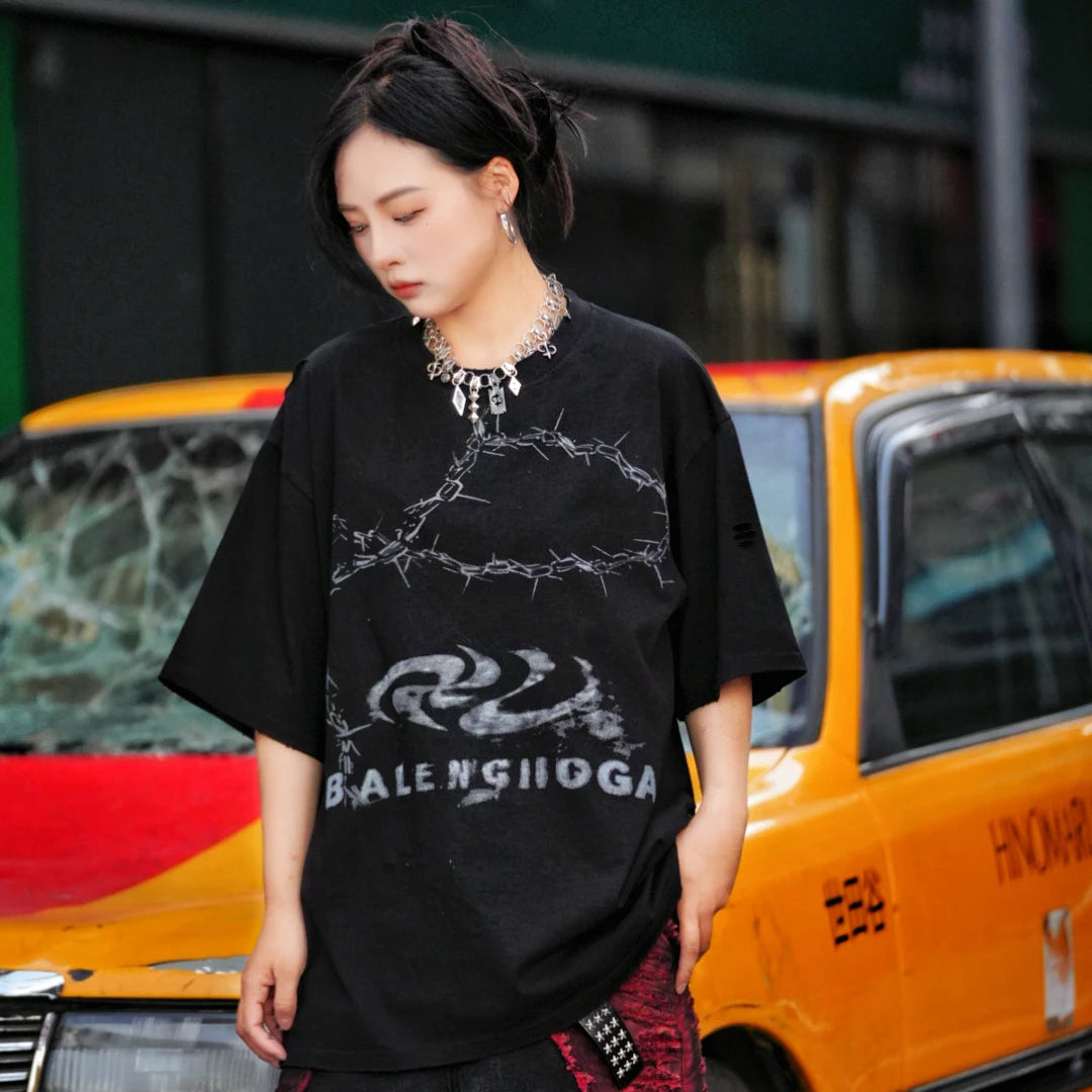 Sanhoostudio short sleeve T-shirt featuring patchwork construction and graphic print design with a relaxed fit silhouette. Designed for modern streetwear styling with comfort, versatility, and everyday wear appeal.