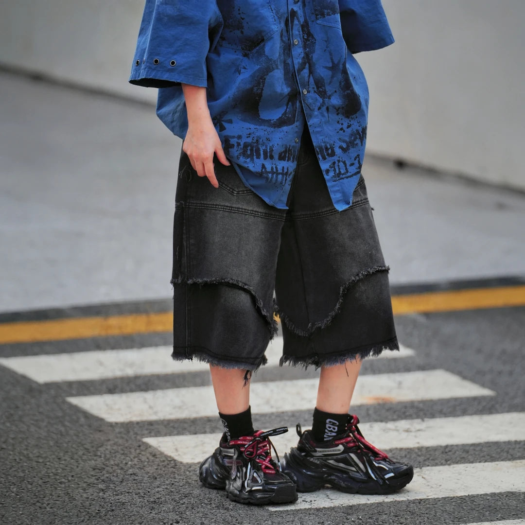 Sanhoostudio denim shorts featuring distressed wash, wide leg silhouette, and relaxed fit design. Perfect for summer streetwear outfits with comfort, durability, and versatile styling.