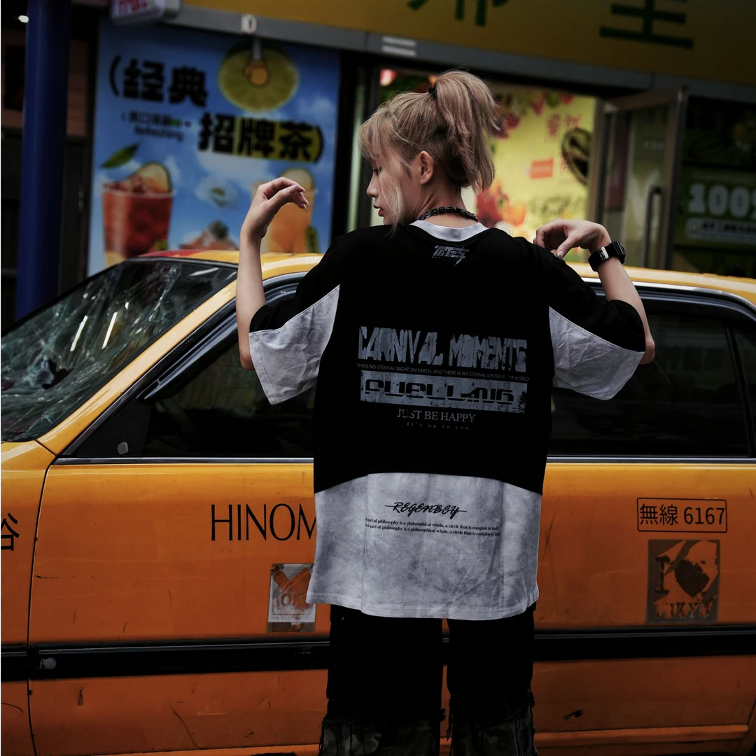 Sanhoostudio short sleeve T-shirt featuring racing-inspired design, patchwork details, and distressed wash. Designed for bold streetwear styling with comfort and breathable summer wear.