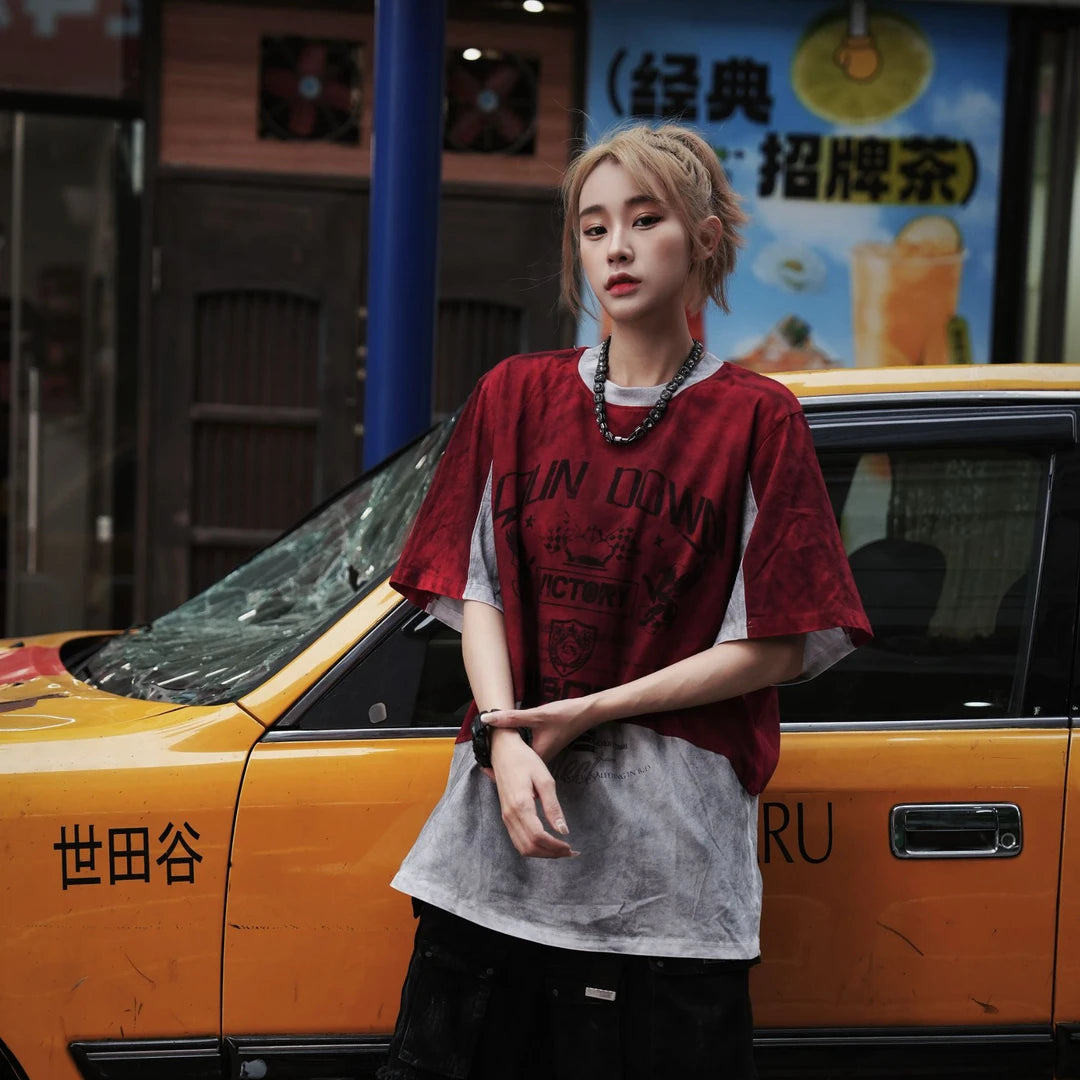 Sanhoostudio short sleeve T-shirt featuring racing-inspired design, patchwork details, and distressed wash. Designed for bold streetwear styling with comfort and breathable summer wear.