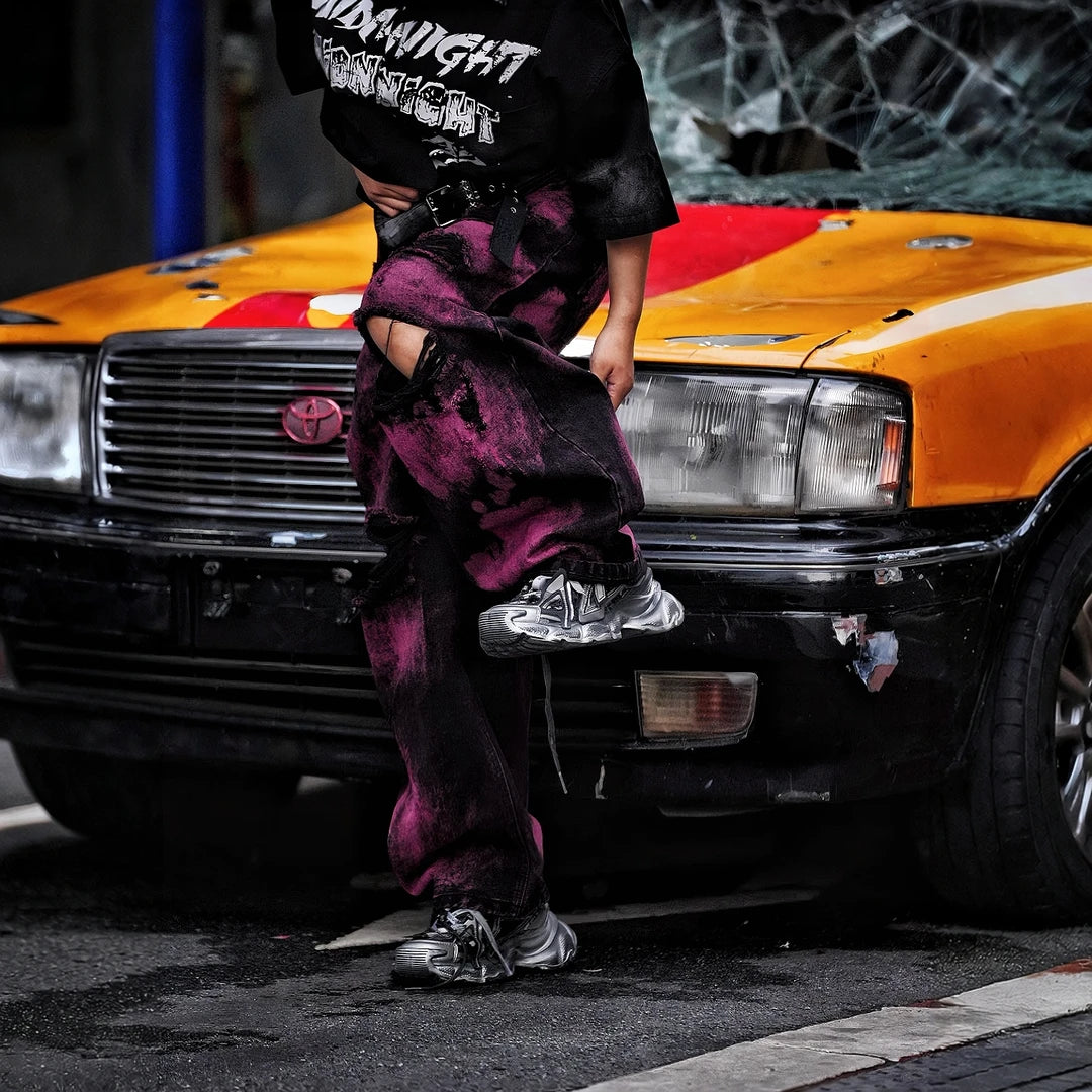 Sanhoostudio wide leg denim pants featuring embroidered detailing, distressed wash, and scythe-cut silhouette. Designed for bold streetwear styling with durability, comfort, and everyday versatility.