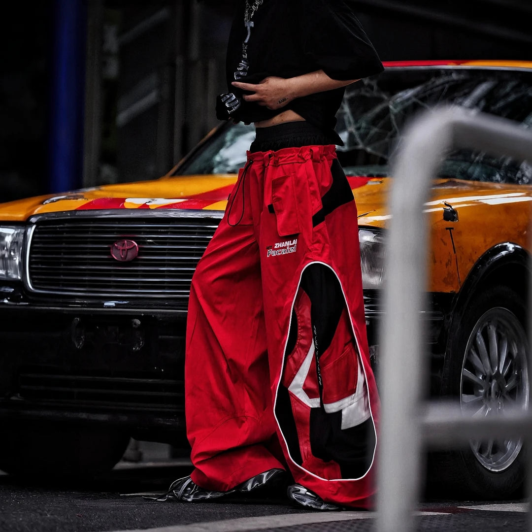 Sanhoostudio denim pants featuring graffiti artwork, patchwork construction, and distressed finish. Built for bold streetwear outfits with wide leg fit, durability, and standout visual styling.