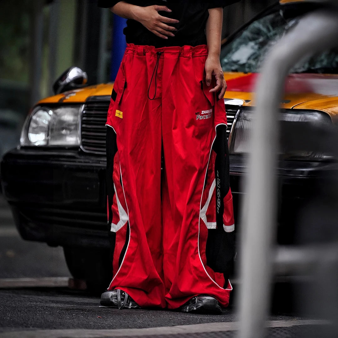 Sanhoostudio denim pants featuring graffiti artwork, patchwork construction, and distressed finish. Built for bold streetwear outfits with wide leg fit, durability, and standout visual styling.