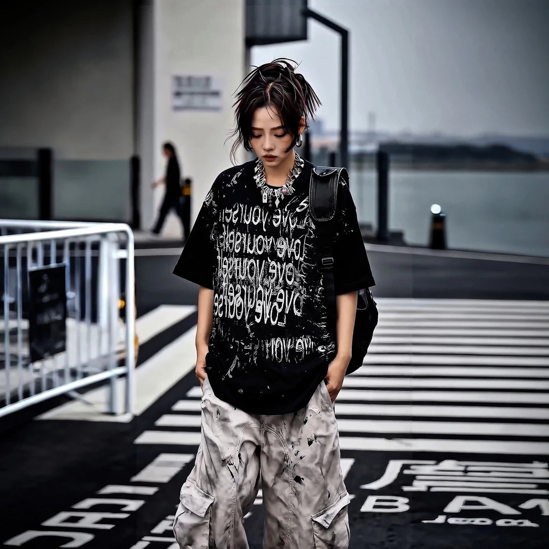 Sanhoostudio short sleeve T-shirt featuring patchwork design and graphic print with a relaxed fit silhouette. A versatile streetwear piece for daily styling with comfort and breathable fabric.
