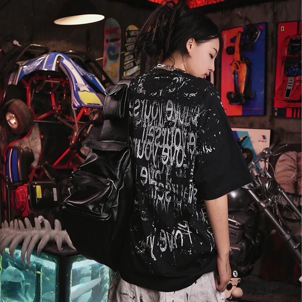 Sanhoostudio short sleeve T-shirt featuring patchwork design and graphic print with a relaxed fit silhouette. A versatile streetwear piece for daily styling with comfort and breathable fabric.
