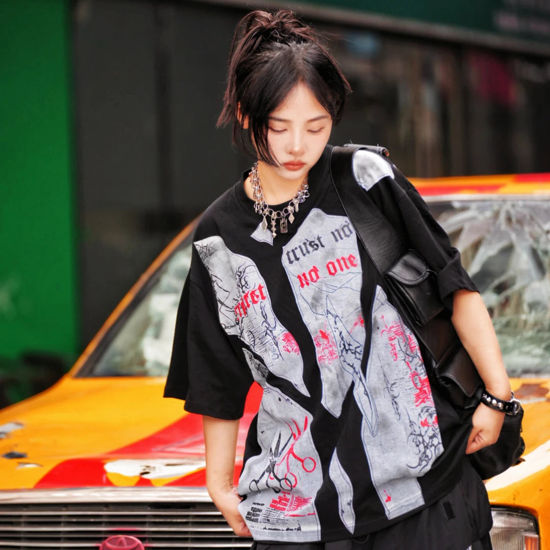 Sanhoostudio short sleeve T-shirt featuring patchwork construction, graphic print design, and oversized fit silhouette. Built for modern streetwear outfits with breathable comfort and everyday versatility.