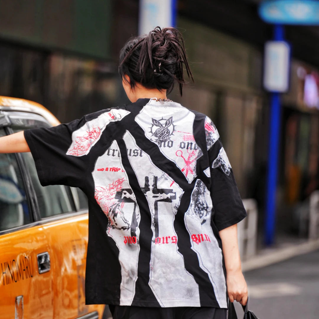 Sanhoostudio short sleeve T-shirt featuring patchwork construction, graphic print design, and oversized fit silhouette. Built for modern streetwear outfits with breathable comfort and everyday versatility.