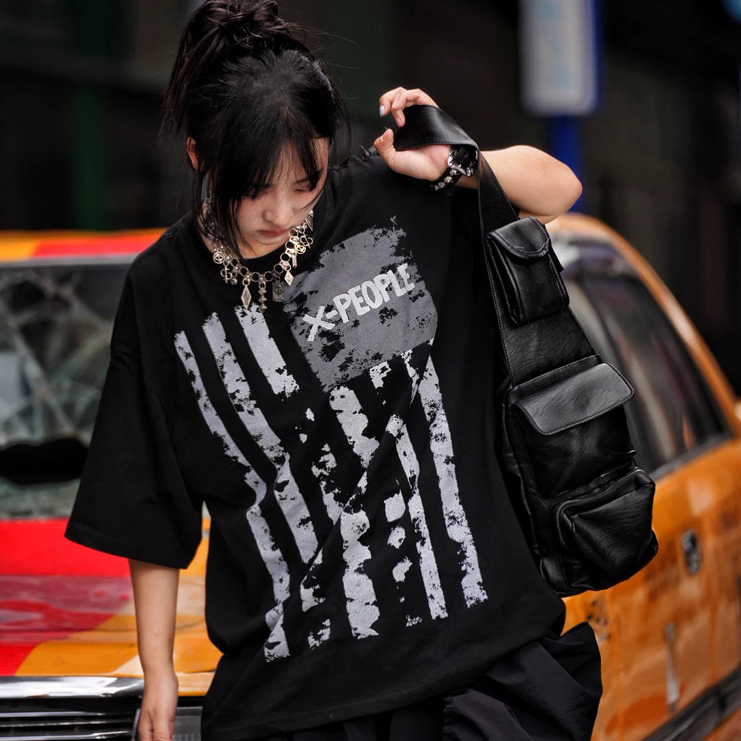 Sanhoostudio short sleeve T-shirt featuring tie dye finish, graphic spray print, and oversized fit silhouette. Perfect for summer streetwear styling with breathable comfort and standout visual design.