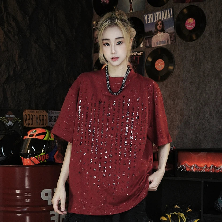 Sanhoostudio oversized T-shirt featuring star-inspired letter print design and heavyweight fabric construction. Designed for casual streetwear outfits with breathable comfort and versatile everyday styling.