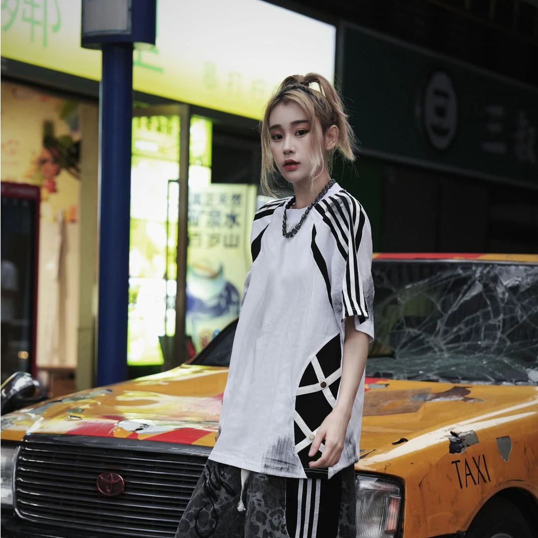 Sanhoostudio short sleeve T-shirt featuring raglan sleeves, colorblock patchwork design, and a relaxed oversized fit. Built for comfortable summer styling with a clean streetwear aesthetic.