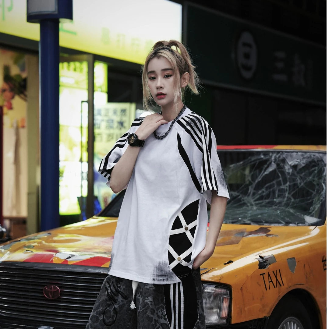 Sanhoostudio short sleeve T-shirt featuring raglan sleeves, colorblock patchwork design, and a relaxed oversized fit. Built for comfortable summer styling with a clean streetwear aesthetic.