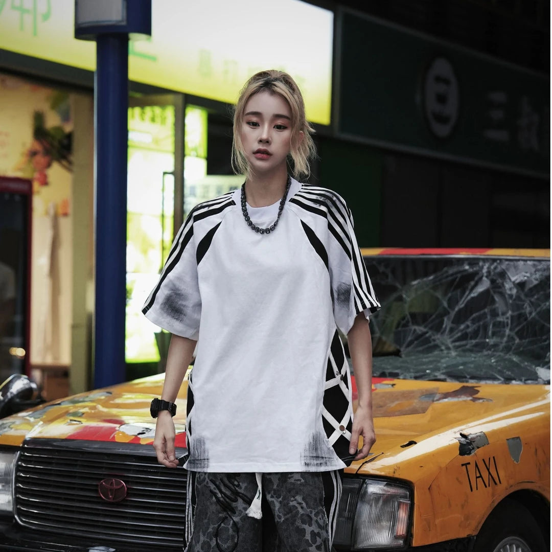 Sanhoostudio short sleeve T-shirt featuring raglan sleeves, colorblock patchwork design, and a relaxed oversized fit. Built for comfortable summer styling with a clean streetwear aesthetic.