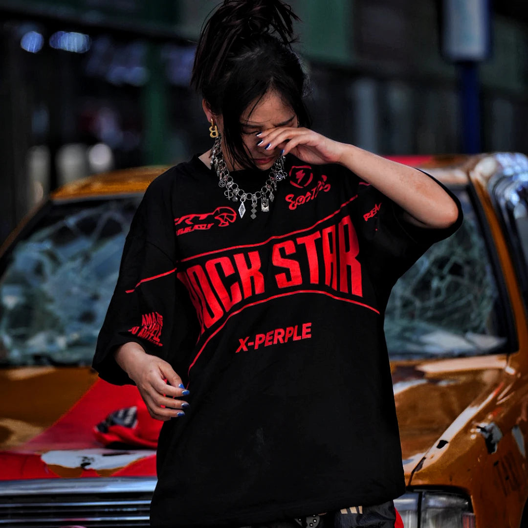 Sanhoostudio short sleeve T-shirt featuring flame-inspired graphic artwork, spray print detailing, and a relaxed oversized silhouette. Designed for modern streetwear styling with breathable comfort and visual impact.