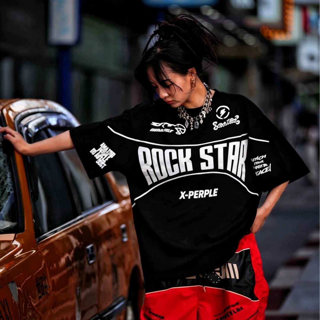 Sanhoostudio short sleeve T-shirt featuring flame-inspired graphic artwork, spray print detailing, and a relaxed oversized silhouette. Designed for modern streetwear styling with breathable comfort and visual impact.