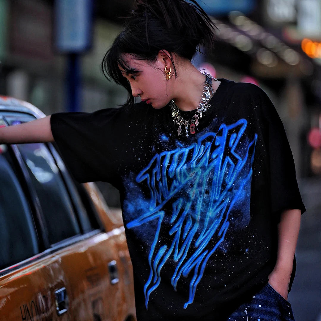 Sanhoostudio short sleeve T-shirt featuring galaxy-inspired graphic artwork, breathable fabric, and a relaxed oversized fit. Perfect for summer streetwear styling with comfort, creativity, and everyday wearability.
